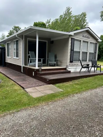 Seasonal Park Model Trailer for Sale 2007 Cottager Escape by Northlander with 2023 H&H hard awning a...