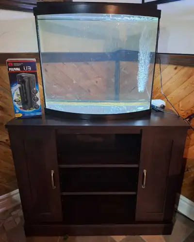 26 Gallon Bow Front Aquarium with Lid. Includes corner stand, Fluval U3 filter ($90 value new), Nicr...