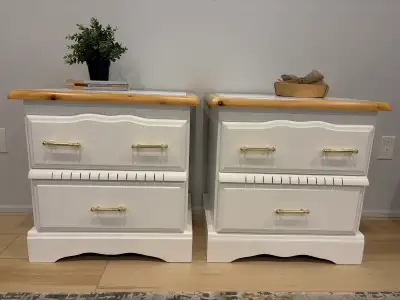 Freshly refinished vintage nightstands with a clean white finish, natural pine edging, and updated g...