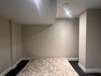 This recently renovated basement offers a spacious, modern living area with high-quality wood-look f...