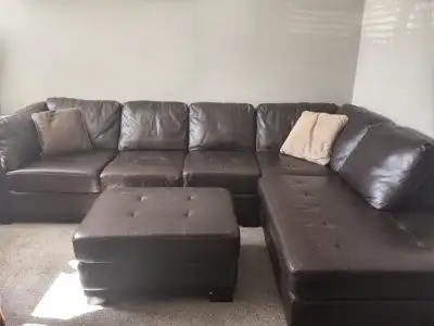 Brown sectional leather ( maybe) couch