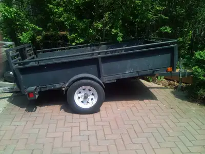 Solid steels snow bear trailer with removable sides, back, and front. Also mc loading ramp