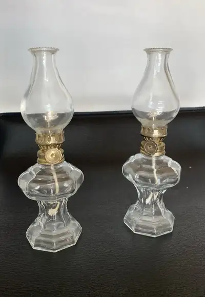 set of 2 vintage small glass oil lamps. 7” tall., View more