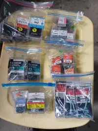 Bags of mixed nails and screws, mostly still sealed.