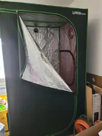 Tent for pre growing flowers and vegatable with lights.