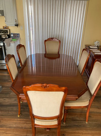 Large Dinning room set. 9 chairs (2 are captain chairs) 