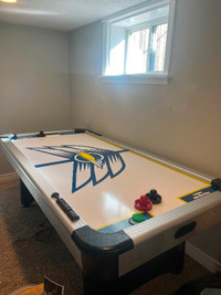 Brunswick 3.6ft X 7ft air hockey table. Gently used and it good