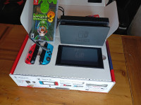 Barely Used Nintendo Switch and Luigi Game