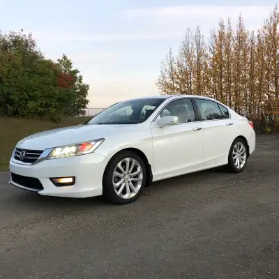 Touring model with navigation and rear heated seats Highway miles-runs great! No accidents New winds...