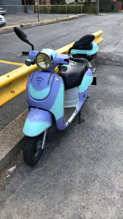 Scooter !! Spray painted really cool colours. The batteries were just recently replaced, but the mot...