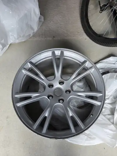 selling a set of used Tesla Model Y 19" OEM rims with brand new tpms and hub caps for $1200, will al...