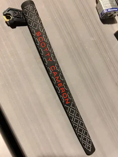 Brand new Scotty Cameron grip off Newport putter. Never used, perfect condition