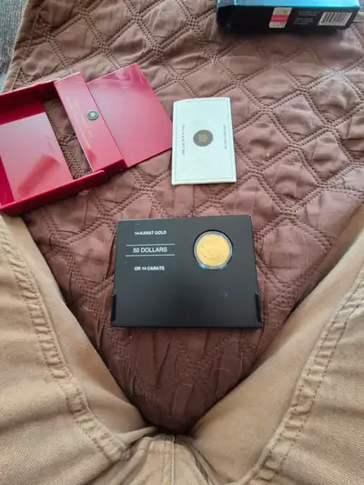 50 dollar 14 karat gold coin selling price 1000.00 call 475 5258