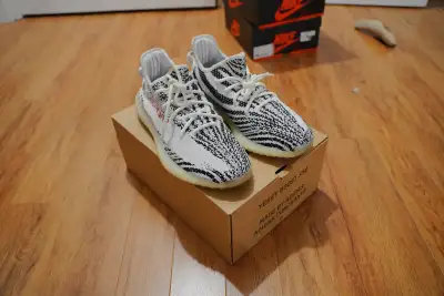 Previously worn size 11 Yeezy Boost 350 v2 Zebras. Condition is very good, very clean. Won bid from...