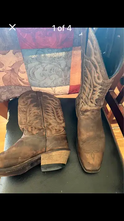 Two pairs of cowboy boots. The Ariats are size 9.5B women’s as you can tell from the bottom they hav...