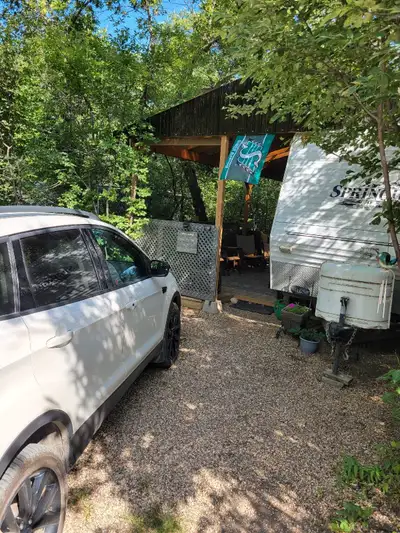 2006 Springdale Camper.27ft.10ft slide. 10x24 covered deck. Everything works as it should. Newer mic...
