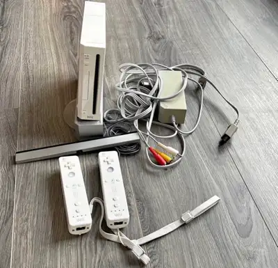 Includes a hdmi to wii adapter, two wiiremotes and whats showing in picture no AV cables