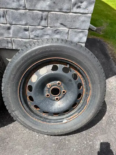 Selling a set of 4 Continental WinterContact SI winter/snow tires mounted on black steel rims, along...