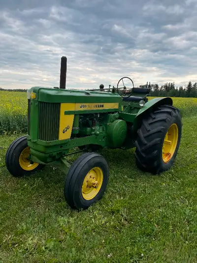 John Deere 620 standard Nice shape tuned up and oils changed $9000 Farmall MD runs and drives needs...