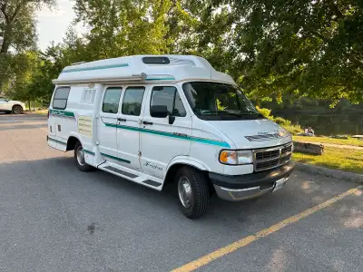 Spotless 1994 Dodge B350 Leisure Travel Freedom Widebody van for sale! This class B motorhome has on...