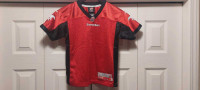 Licensed Calgary Stampeders Reebok jersey, mint, kids medium 5/6