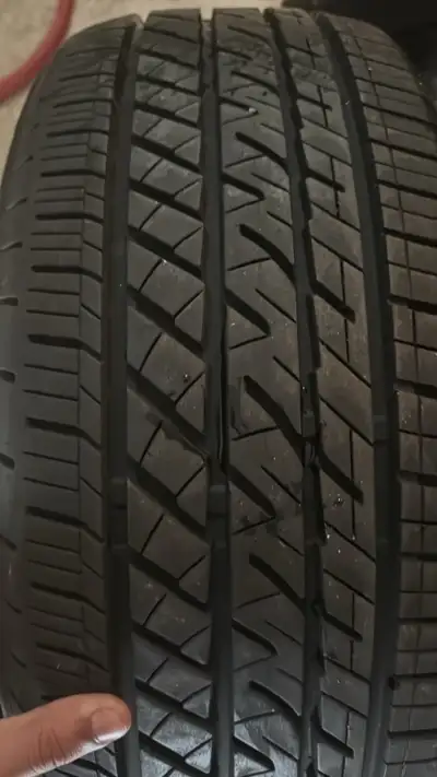 Bridgestone all season tires size 215/50r17 only two tires/one pair Tires have around 90 percent tre...