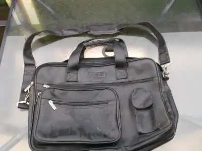 Buxton Leather Laptop Computer Bag. Bag is in good used condition with a protector pouch included. A...