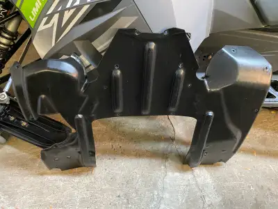 This skid plate is made of high impact, thick, black plastic, which can save your snowmobile from a...