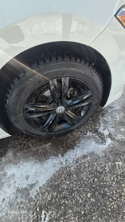 Selling winter set tires 215/50/17 with jetta R line stock rims freshly powdered to gloss black with...
