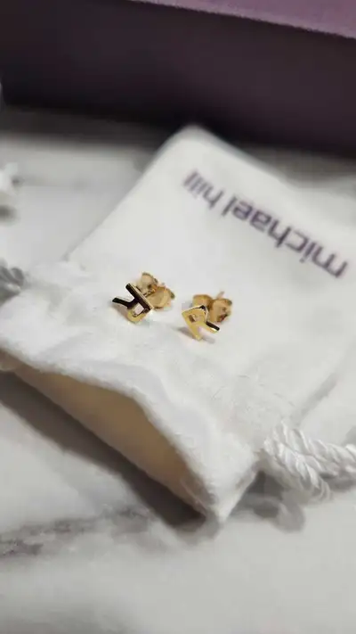 Brand new "R" initial earrings from Michael Hill in 10kt yellow gold. Bought wrong initials and was...