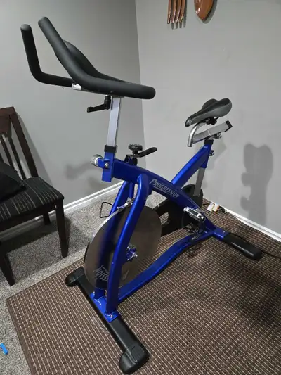 Spin bike and treadmill, View more