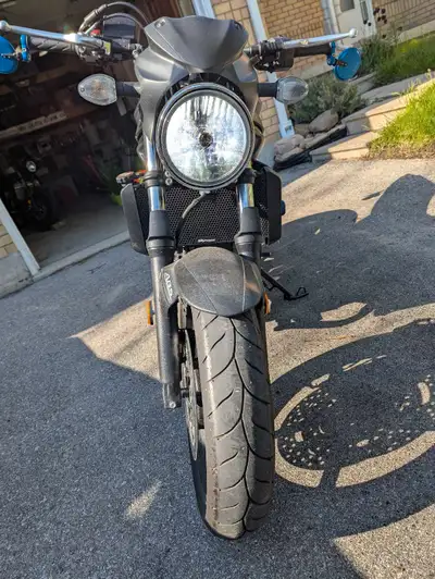 Low KM SV650, has fender delete, radiator cover, side mirror, dropped handle bar and aftermarket exh...