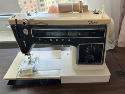 Singer “Diana” Sewing machine and cabinet, View more