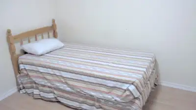 1 Furnished Bedroom with a window in a Large Clean 3 Bedroom Basement Apartment is available for Ren...