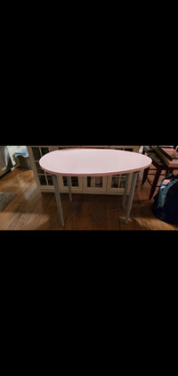 Pink ikea oval adjustable desk with pink floating shelf