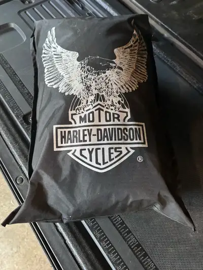 Harley Davidson motorcycle cover. Comes with storage bag. Two tone diver and black. Hardly used.