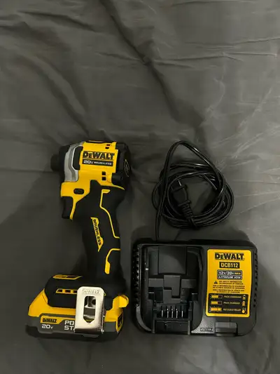 Selling a Dewalt 20V Atomic Impact Driver, with a charger and a PowerStack battery. Everything is on...