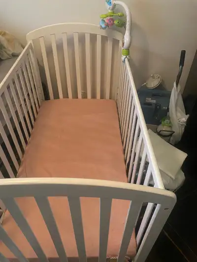 Crib with mobile and mattress including sheet, View more