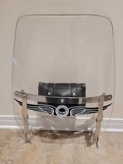 I am selling a Harley Davidson windshield designed for a Fatboy model. This windshield is in used co...