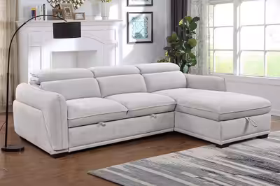 Sink into the plush comfort of this used sectional sofa, designed with a pull-out bed and convenient...