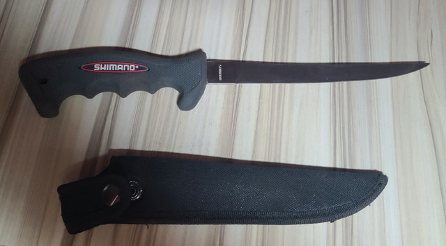 Shimano filled knife with sheath. in Hobbies & Crafts in London