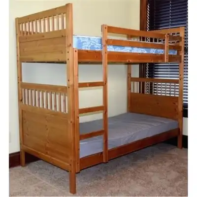 This is an IKEA solid wood twin over twin bunk bed, perfect for kids or small spaces. It's in good c...