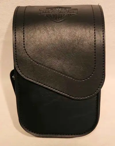 Harley Davidson saddlebag guard bag. This leather auxiliary bag snaps onto the metal saddlebag guard...