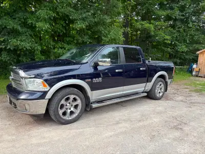 2013 Dodge Ram 1500 Laramie, no accidents, 1 owner has 20" tires and a second set of aluminum rims a...