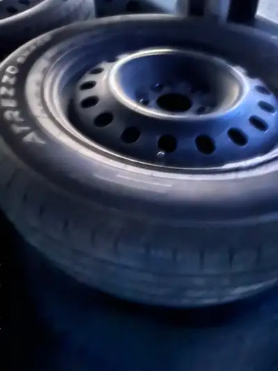 215/65/17 5 bolt Winter tires & rims. 1 tire is pretty bald, Other 3 hav decent amount of tread left...