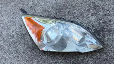 Selling a used headlight assembly for a 2007–2011 Honda CR-V. This is an original OEM part manufactu...