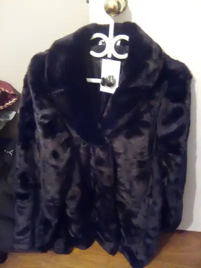 These ladies' winter coats are brand new and come in size large, perfect for adding a touch of class...