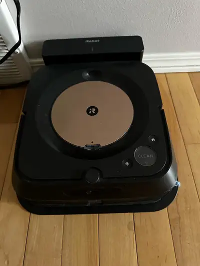 Robot mop with extra mopping pads and cleaning solution. Barelt used. Upgraded my systems and does n...