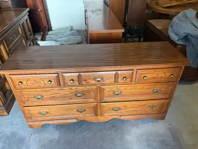 140$ 61 inch by 18 inch (30 inch high) This is a used sturdy oak dresser with eight drawers. It feat...
