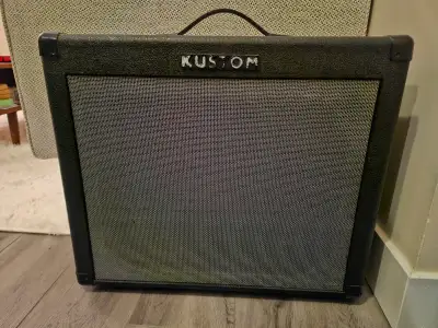 Kustom KGA 65. Great distortion/drive channel and all your effects built right in. Celestion speaker...